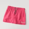 Badshorts med tryckt logotyp Badshorts med tryckt logotyp
