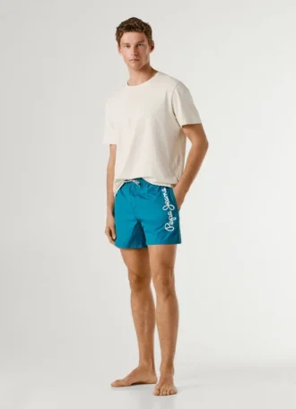 Badshorts med tryckt logotyp