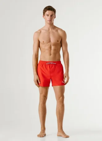 Badshorts med tryckt logotyp