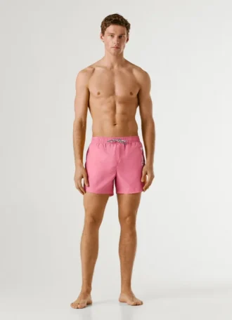 Badshorts med tryckt logotyp