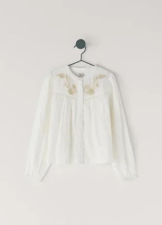 Blus med broderade detaljer