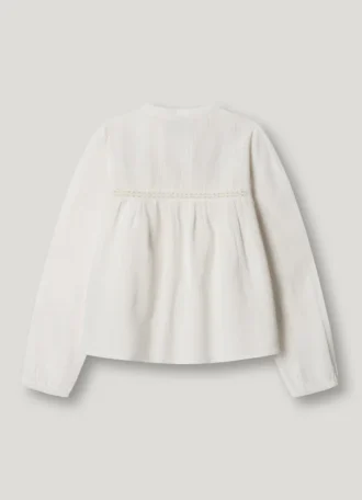 Blus med broderade detaljer