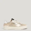 Guldfärgade sneakers med djurmönster Guldfärgade sneakers med djurmönster