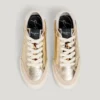 Guldfärgade sneakers med djurmönster Guldfärgade sneakers med djurmönster