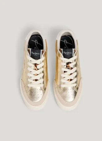 Guldfärgade sneakers med djurmönster