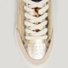 Guldfärgade sneakers med djurmönster Guldfärgade sneakers med djurmönster